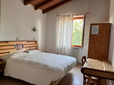 Letto o letti in una camera di Il Cortile Agriturismo