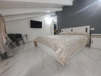 Letto o letti in una camera di B&B Deluxe