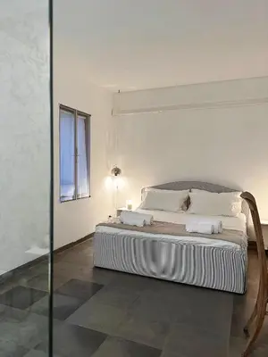 Letto o letti in una camera di Arazzo Apartments