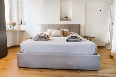 Letto o letti in una camera di Monolocale San Pietro centro storico di Reggio Emilia