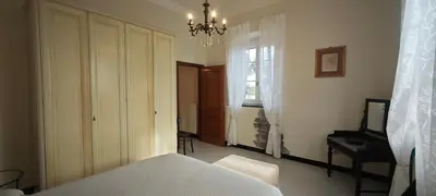 Letto o letti in una camera di Casa Margherita