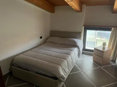 Letto o letti in una camera di Appartamento via Giorgio Canale 72