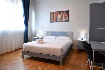 Letto o letti in una camera di Palazzo Cavalieri business&relax 10Galvano