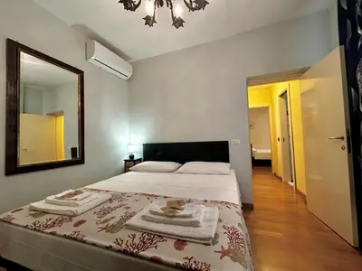 Letto o letti in una camera di JOY Triolcale in centro con terrazza