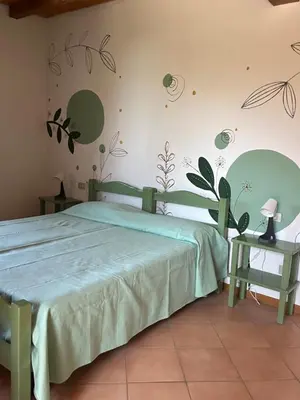 Letto o letti in una camera di La Stornaia
