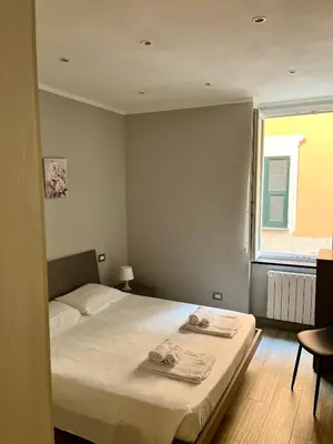 Letto o letti in una camera di Bilocale 'I Portici'