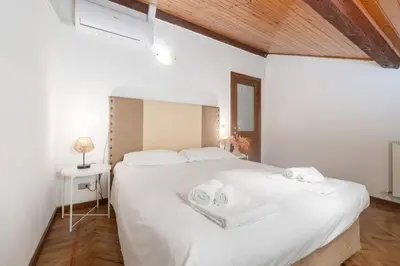 Letto o letti in una camera di La Mansarda del Borgo