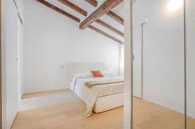 Letto o letti in una camera di Respiro di Ghirlandina - Rua Frati 34 Palace by MoVeBNB
