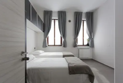 Letto o letti in una camera di La Corte Affitti Brevi