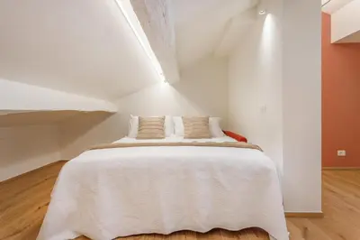 Letto o letti in una camera di Corso Adriano 13 - La Bonissima