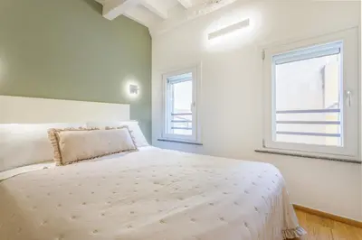 Letto o letti in una camera di Corso Adriano 13 - I Giardini