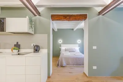Letto o letti in una camera di Corso Adriano 13 - I Giardini
