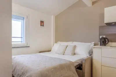 Letto o letti in una camera di Corso Adriano 13 - I Portici