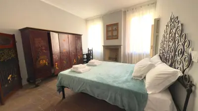 Letto o letti in una camera di Corte Onorata - Manu Maison