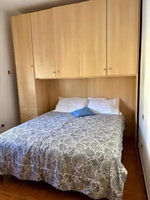 Letto o letti in una camera di Casa Vacanza Ginevra