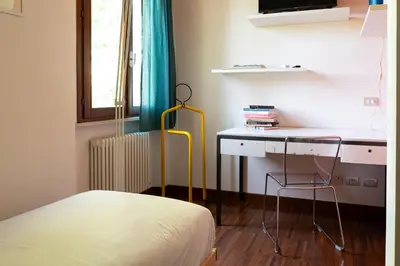Letto o letti in una camera di MA SE PIACENZA - Pontenure