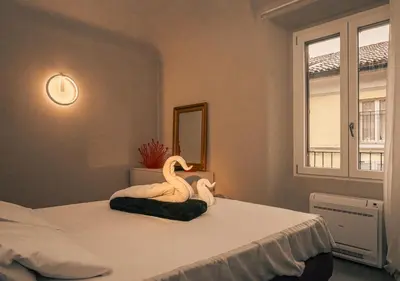 Letto o letti in una camera di Heart of Piacenza Luxury Apt, 100m Piazza Cavalli