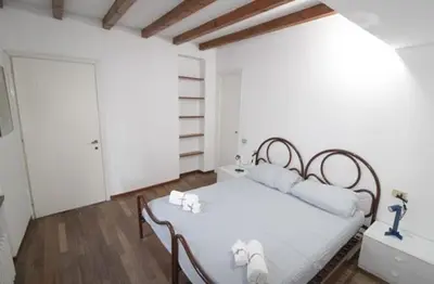 Letto o letti in una camera di Penthouse in the center of Parma - bookable parking space