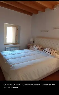 Letto o letti in una camera di Casa OTELLI