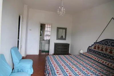Letto o letti in una camera di Five Lands Pink Cottage