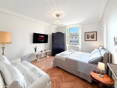 Letto o letti in una camera di Attico d'Autore in Piazza con Vista Ghirlandina