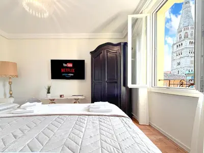 Letto o letti in una camera di Attico d'Autore in Piazza con Vista Ghirlandina