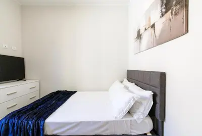 Letto o letti in una camera di Casa Valentina - WiFi Train Station Parking