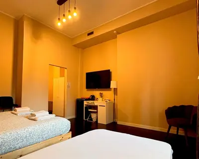 Letto o letti in una camera di The Central Rock Inn camere con bagno privato
