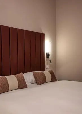 Letto o letti in una camera di La Maison de Ville & Suite