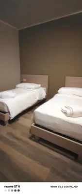 Letto o letti in una camera di OSTERIA IL BECCO FINE affittacamere