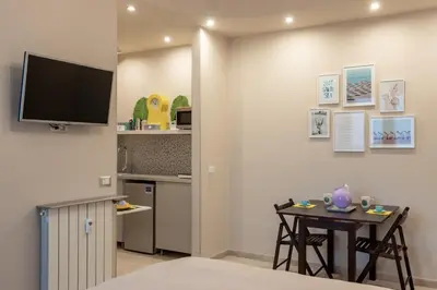 TV o dispositivi per l'intrattenimento presso JOIVY Cerisola Perfect Apartment with Terrace in Rapallo