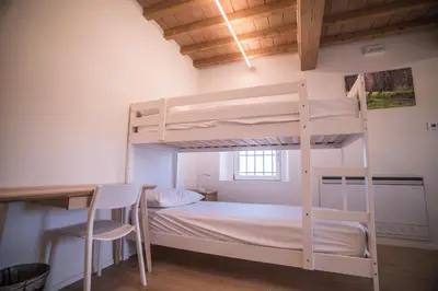 Letto o letti in una camera di Casa per ferie Cà Monte - Borzano di Albinea