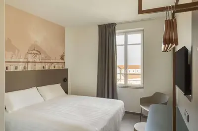 Letto o letti in una camera di B&B HOTEL Piacenza