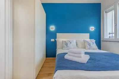 Letto o letti in una camera di Corso Adriano 13 - La Torre