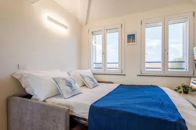Letto o letti in una camera di Corso Adriano 13 - La Torre