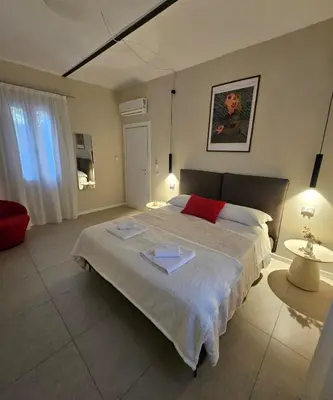 Letto o letti in una camera di Casagalaverna con giardino
