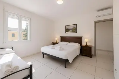 Letto o letti in una camera di Rubiera Residence - H24