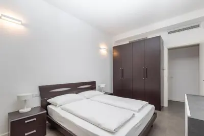 Letto o letti in una camera di Appartamenti Torre del Capitano