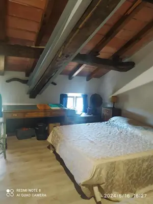 Letto o letti in una camera di Ampia stanza nelle campagne parmensi