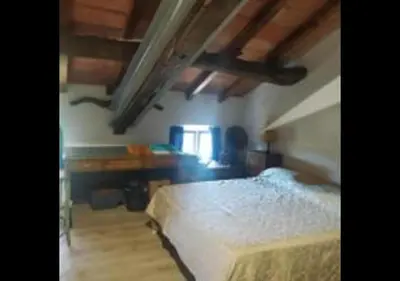 Letto o letti in una camera di Ampia stanza nelle campagne parmensi