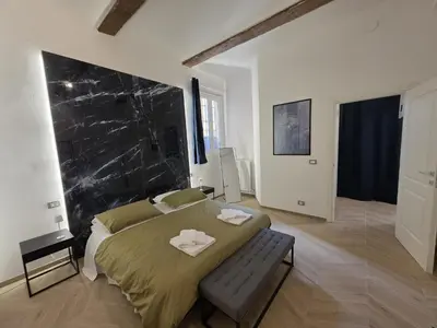 Letto o letti in una camera di MWC - Modena via Ganaceto 100