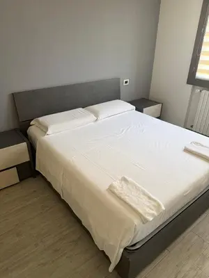 Letto o letti in una camera di Sc Sweet House Parma
