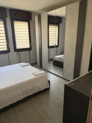 Letto o letti in una camera di Sc Sweet House Parma