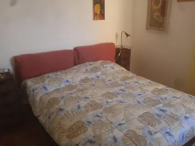 Letto o letti in una camera di Alma Lupi