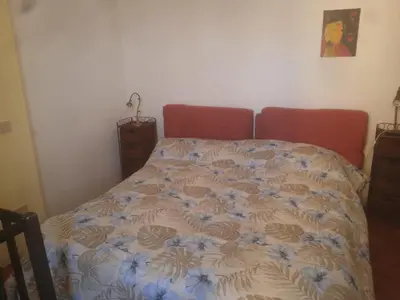 Letto o letti in una camera di Alma Lupi
