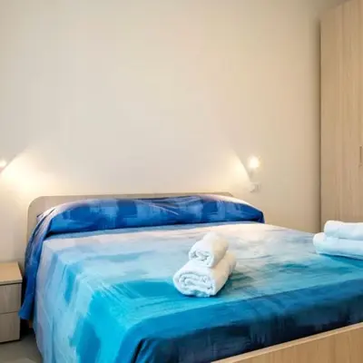 Letto o letti in una camera di Mare fuori, sul lungomare con tre camere da letto e due bagni!