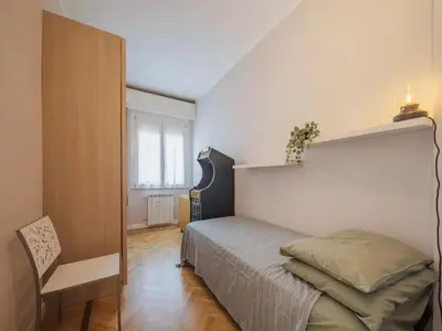 Letto o letti in una camera di Enrico