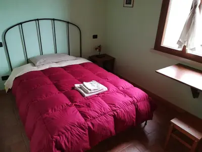 Letto o letti in una camera di Agriturismo Loghino Sabbioni