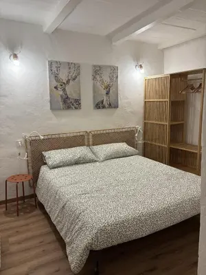 Letto o letti in una camera di Charme a Corniglio