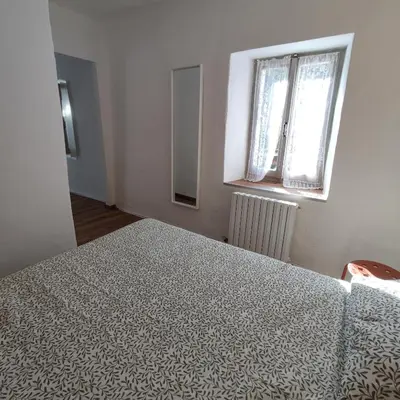 Letto o letti in una camera di Charme a Corniglio